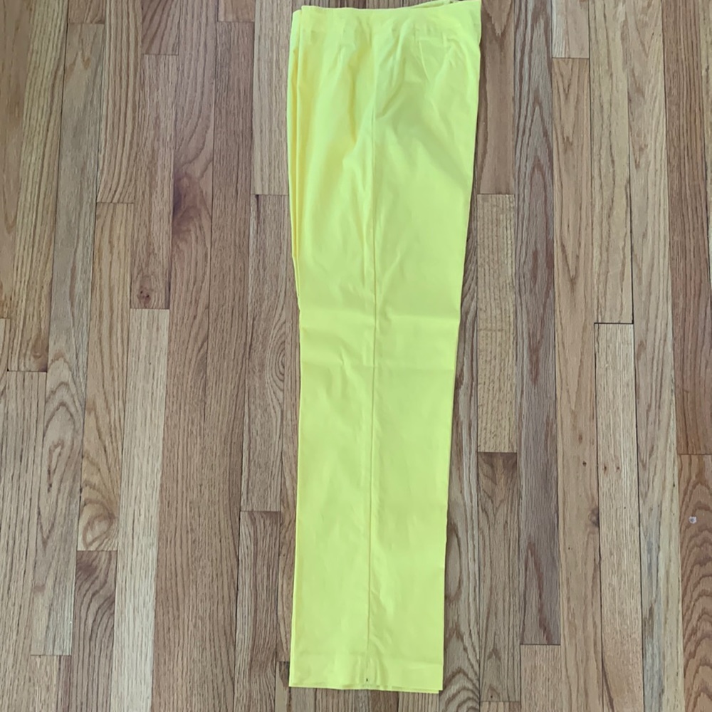 Woman’s yellow slacks